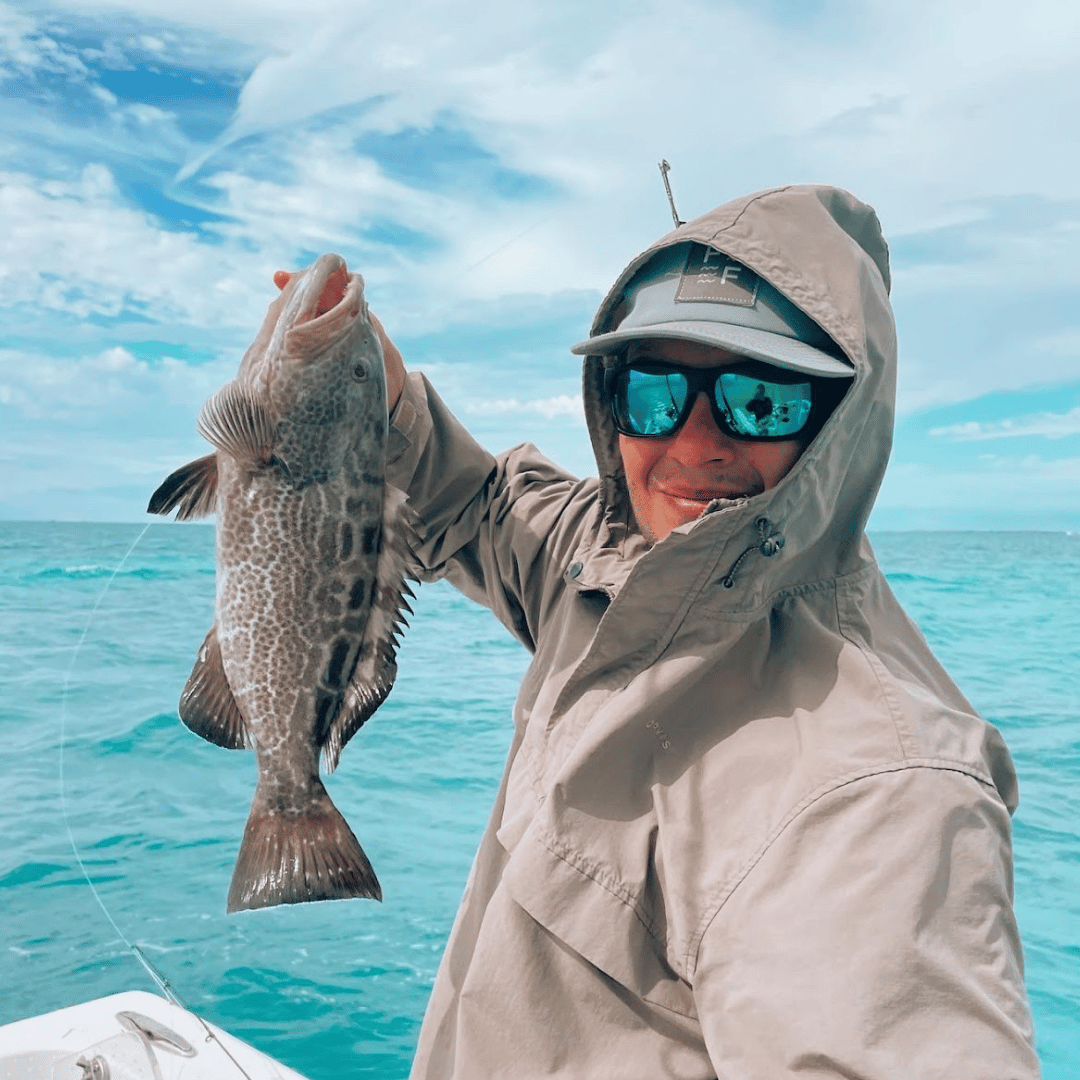 Joe Maier Image of Joe Maier holding a fish.
